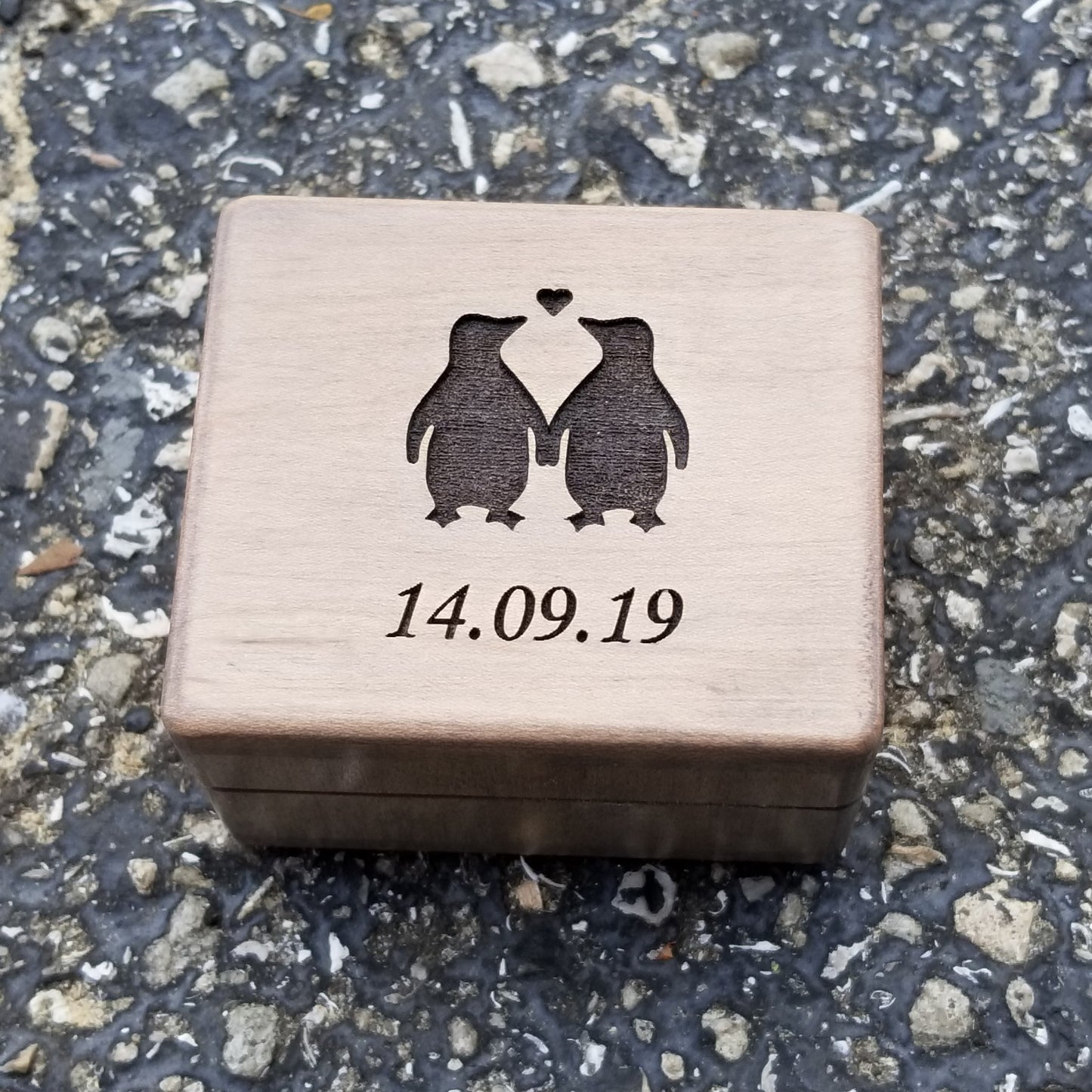 engagement ring box with penguins and date