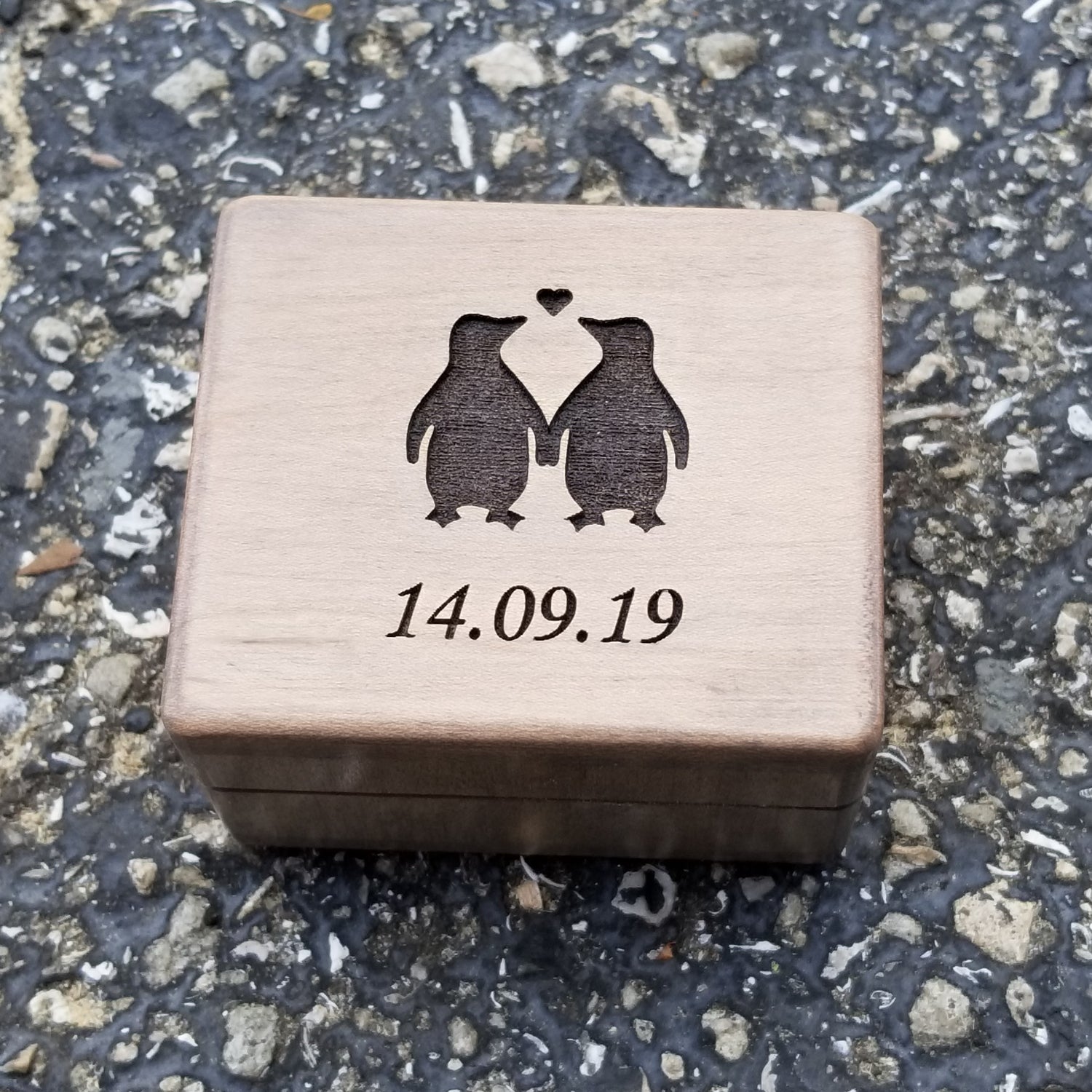 engagement ring box with penguins and date
