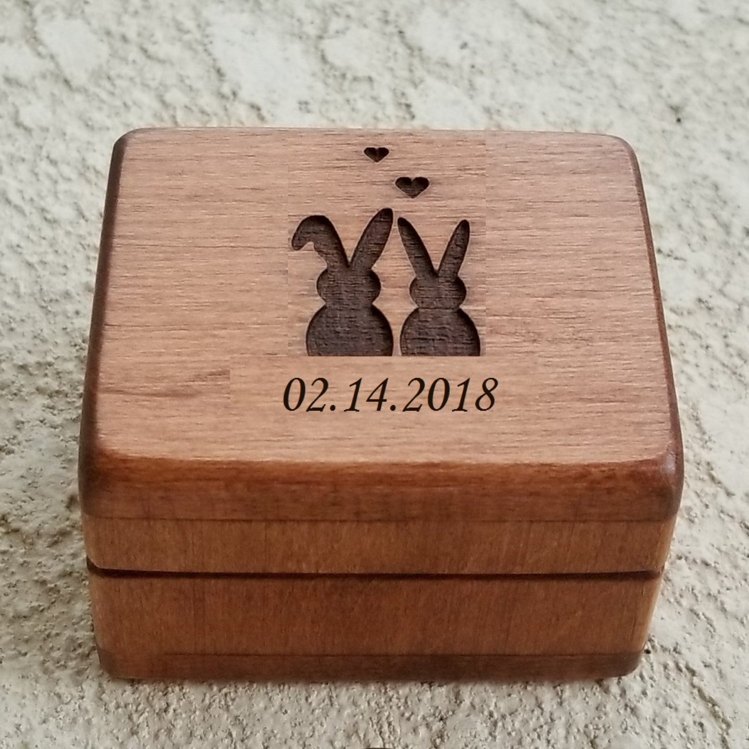 ring box with 2 bunnies and date engraved on top